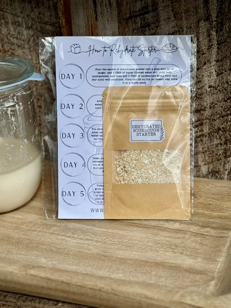 Packaged dehydrated sourdough starter with a label on a wooden surface