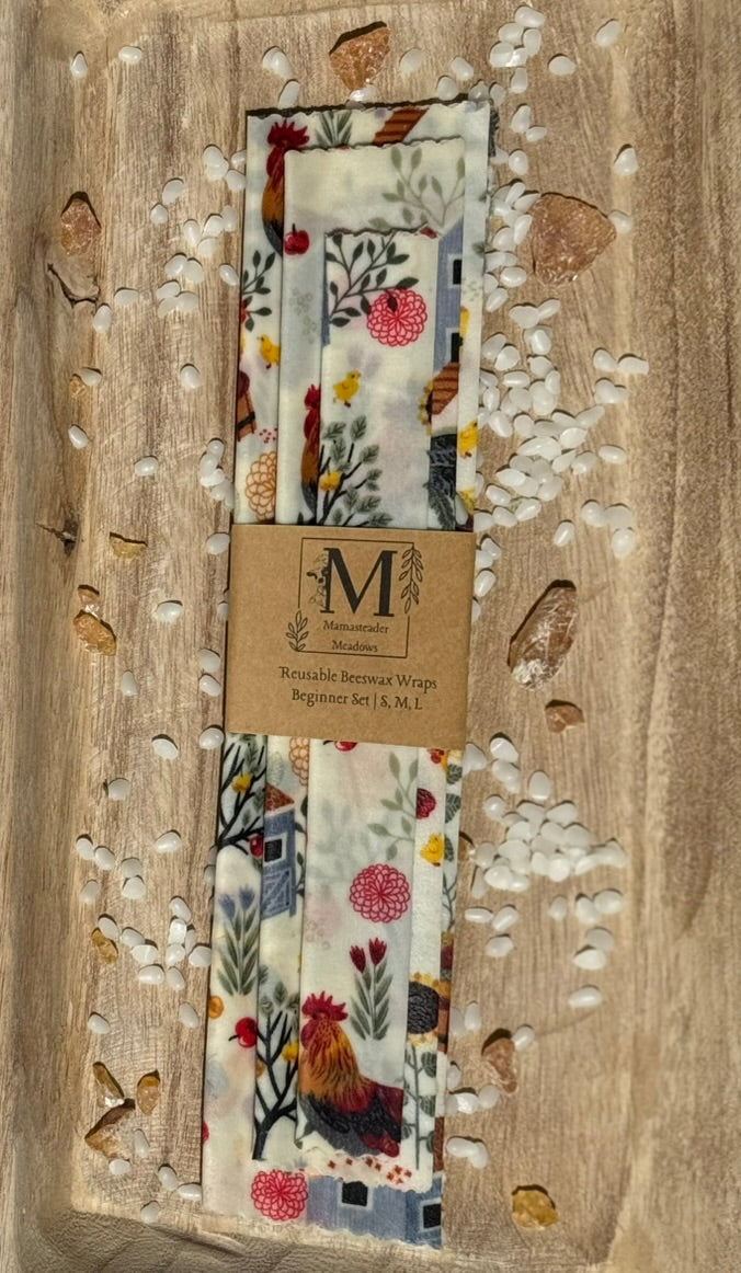 Set of Reusable Beeswax Wraps - Beginner Set brand label on a wooden surface.